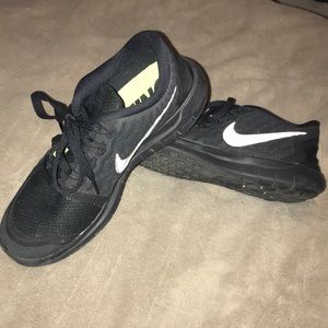All black Nike Free running shoe size 7.5